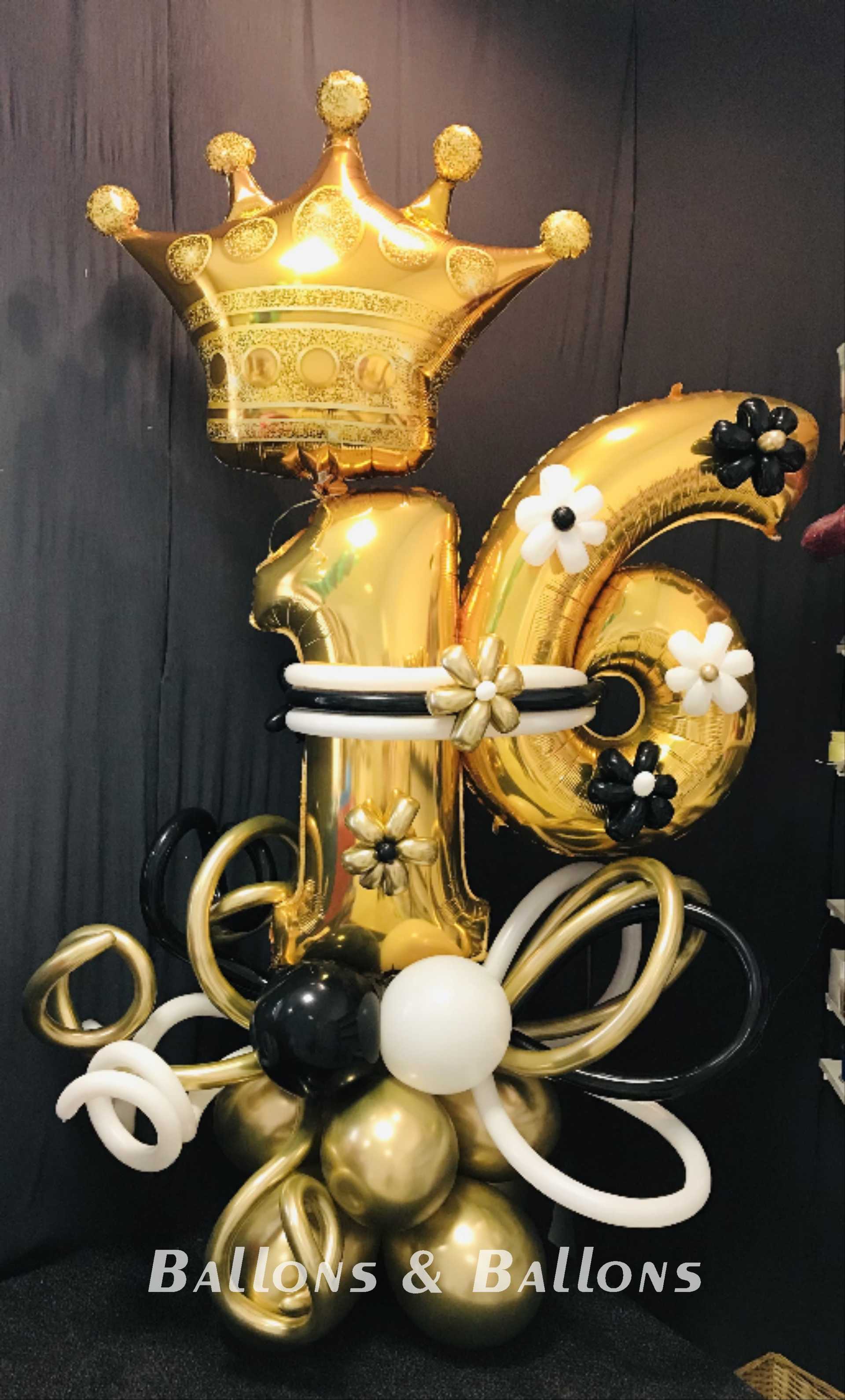 Eine große schwarze und goldene Geburtstagskrone.